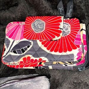 Vera Bradley wallet, holds phones as well.